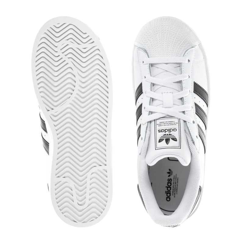 Kids' adidas low-top sneakers, outsole tread and side view with white upper and black stripes