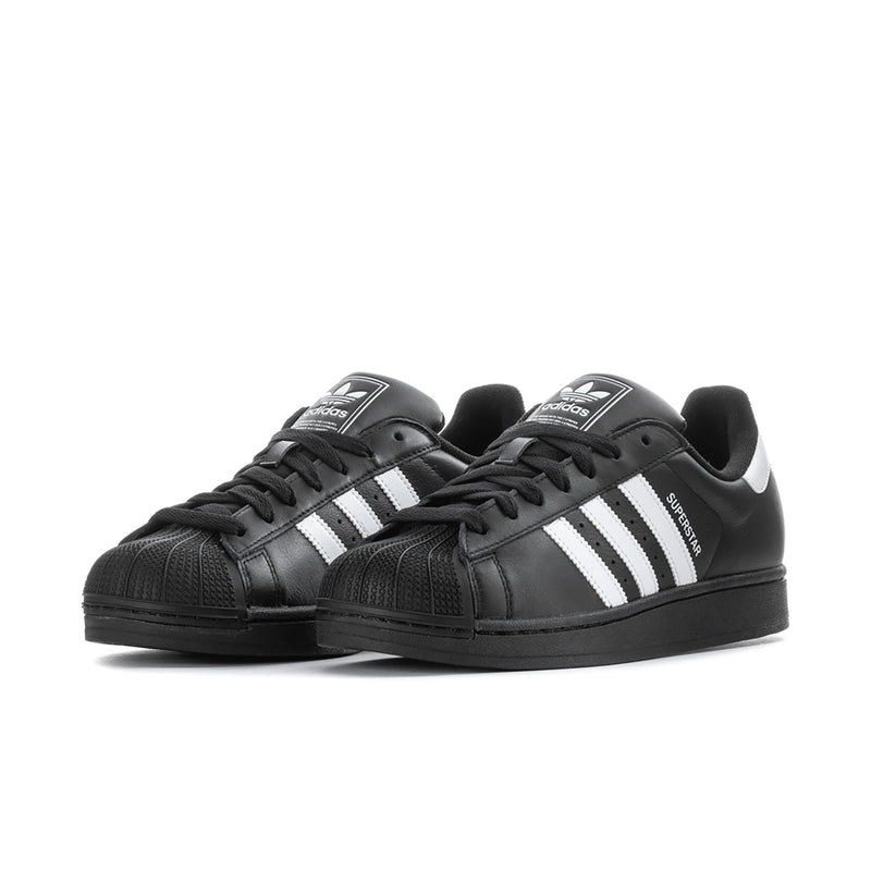 Black leather lace-up sneakers with white side stripes and padded tongue