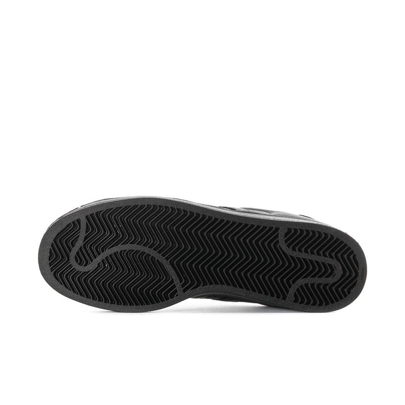 Black rubber sneaker outsole with textured tread pattern for grip.