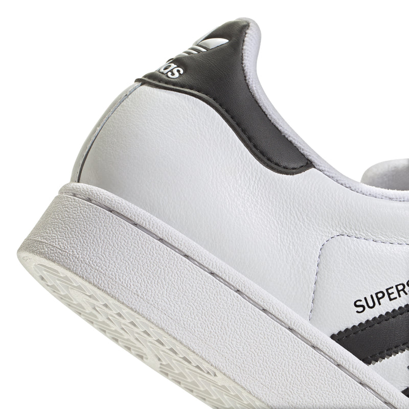 Side close-up of men's adidas Superstar II sneaker in white leather with black heel patch