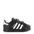 Toddler black sneakers with white triple stripes and Velcro strap