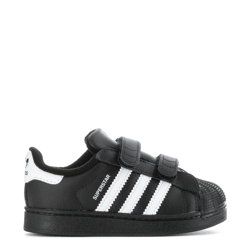 Toddler black sneakers with white triple stripes and Velcro strap