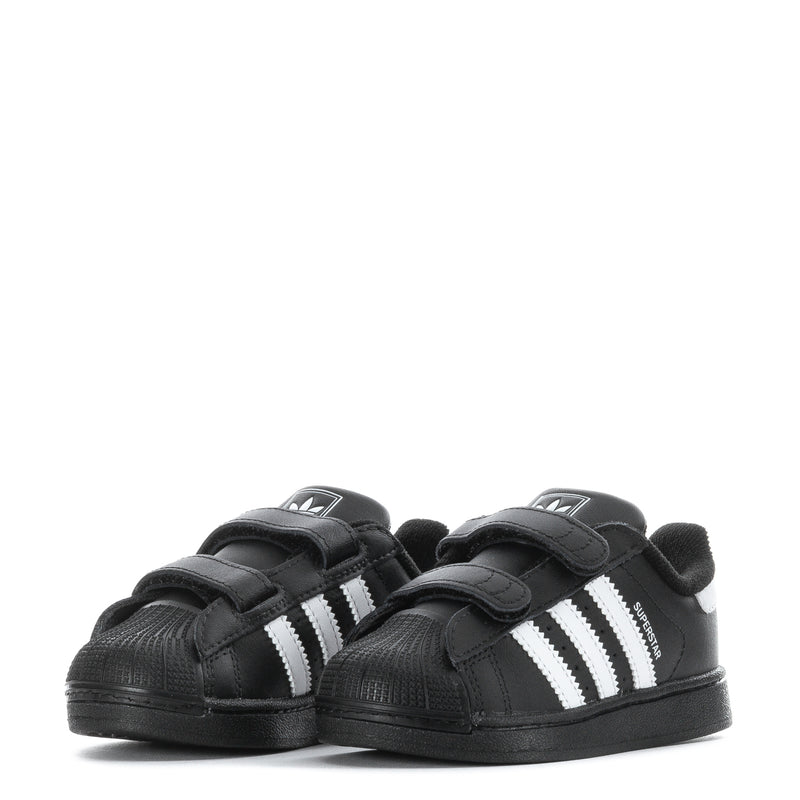Toddler black sneakers with white triple stripes and two Velcro straps, pair view