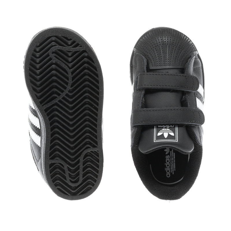 Toddler black sneakers with treaded outsole and Velcro strap detail
