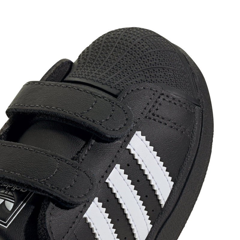 Toddler black leather sneaker upper with white triple stripes and Velcro strap