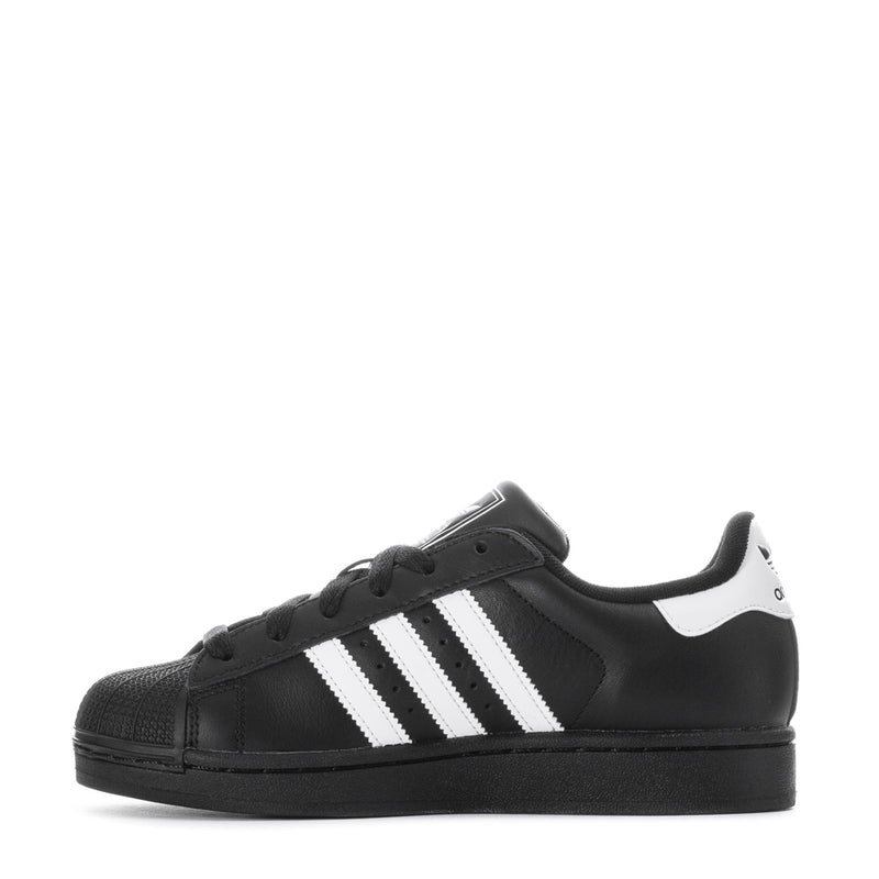 Black low-top lace-up sneakers with white three-stripe side and white heel panel.