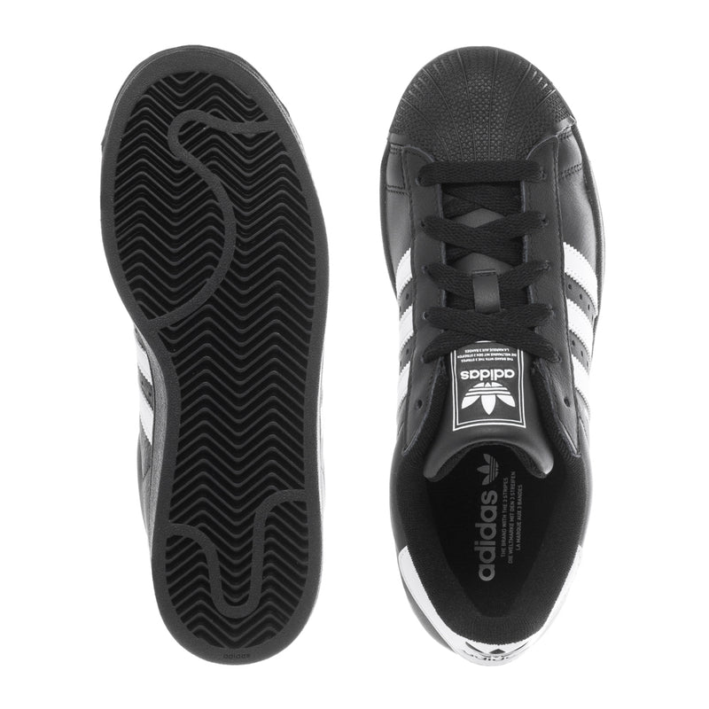 Black sneaker outsole and heel view with lace-up upper and white logo stripes.