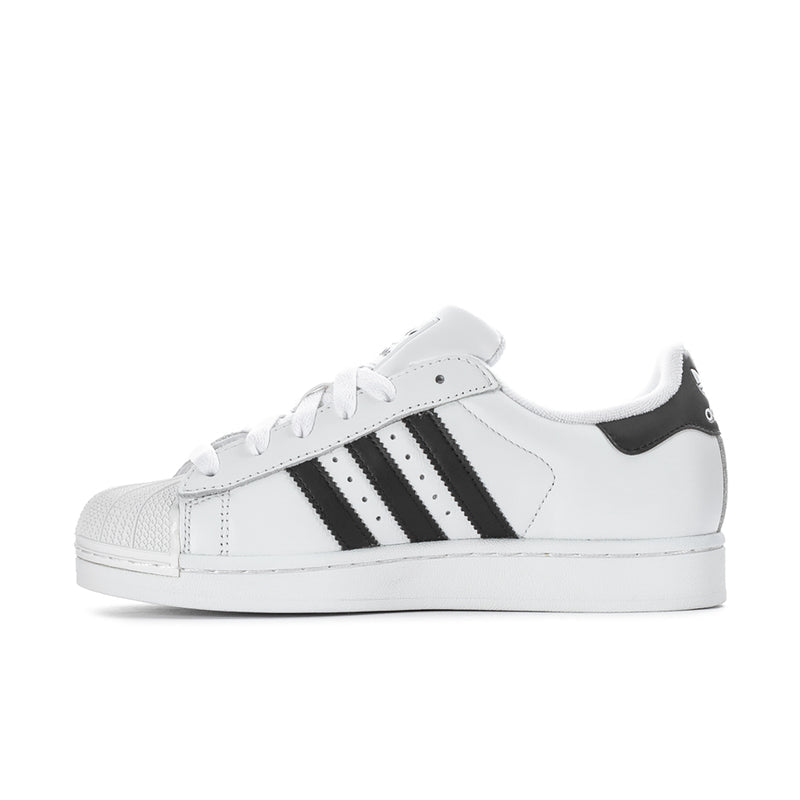 Women's white low-top sneakers with black side stripes and stitched toe cap