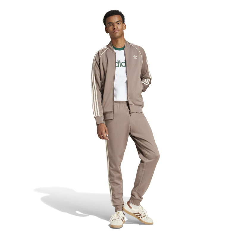 Men's taupe track pants with tapered legs and three white side stripes