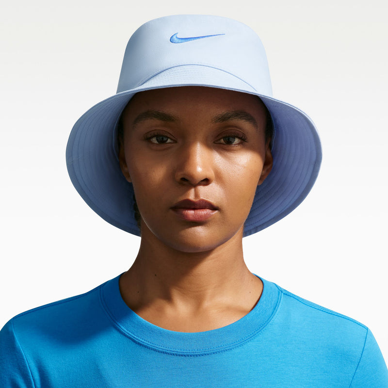 Light blue Nike bucket hat with curved brim and Swoosh logo