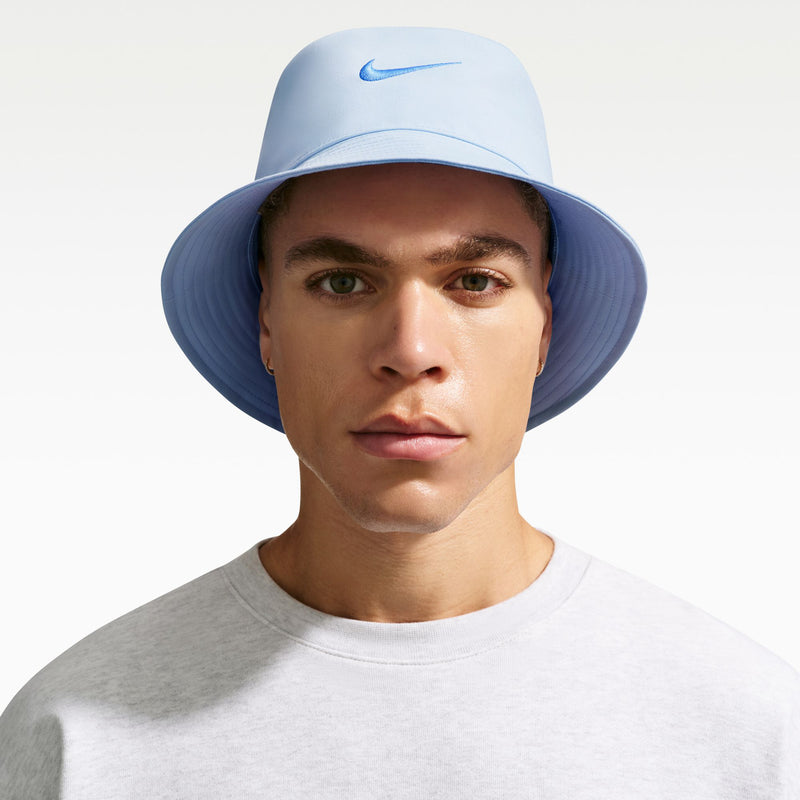 Light blue Nike bucket hat with small Swoosh logo on crown