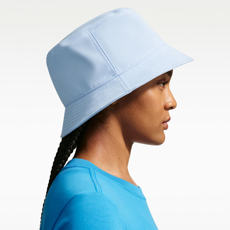 Light blue Nike bucket hat side profile with stitched panels and seams