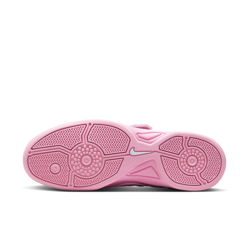 Pink outsole of women's low-top sneakers with textured traction pattern