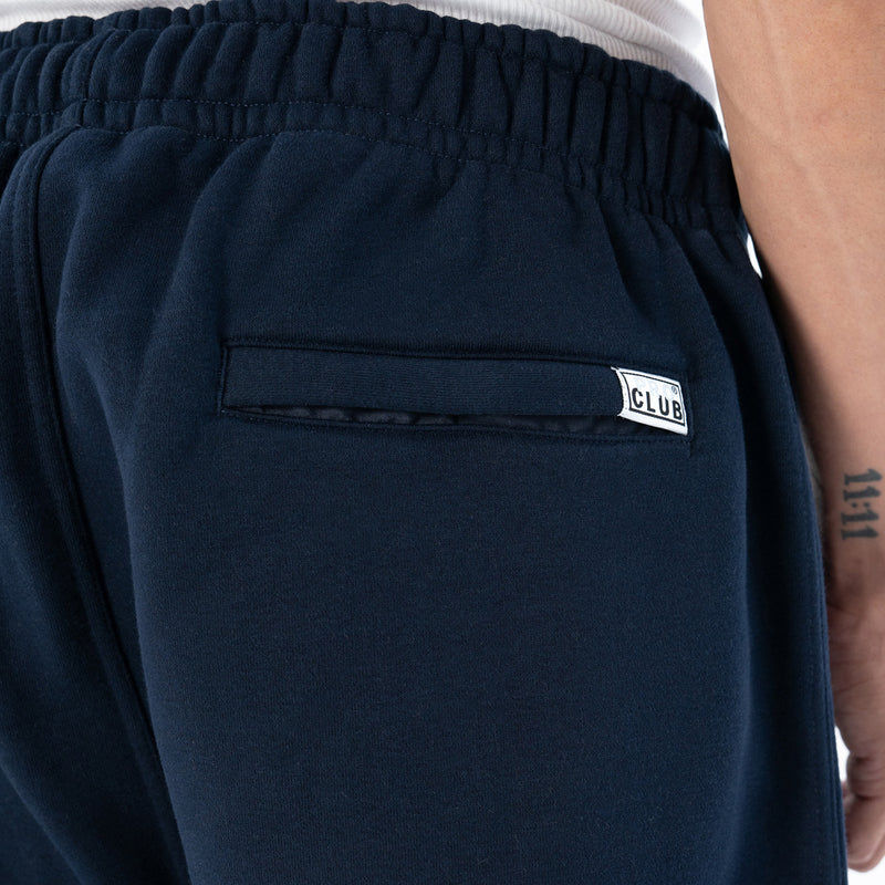 Navy fleece cargo pants with elastic waistband and 'CLUB' logo patch on pocket