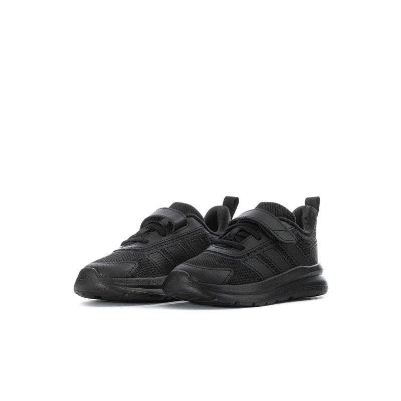 Toddler black running shoes, side view, with three stripe details and low sole