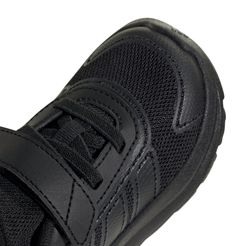 Toddler black sneaker close-up of textured upper and stitched strap overlays