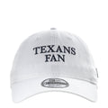 White baseball cap with navy “TEXANS FAN” front embroidery and stitched panel seams