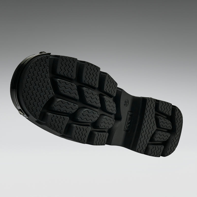Close-up of a black sandal sole on a gray background