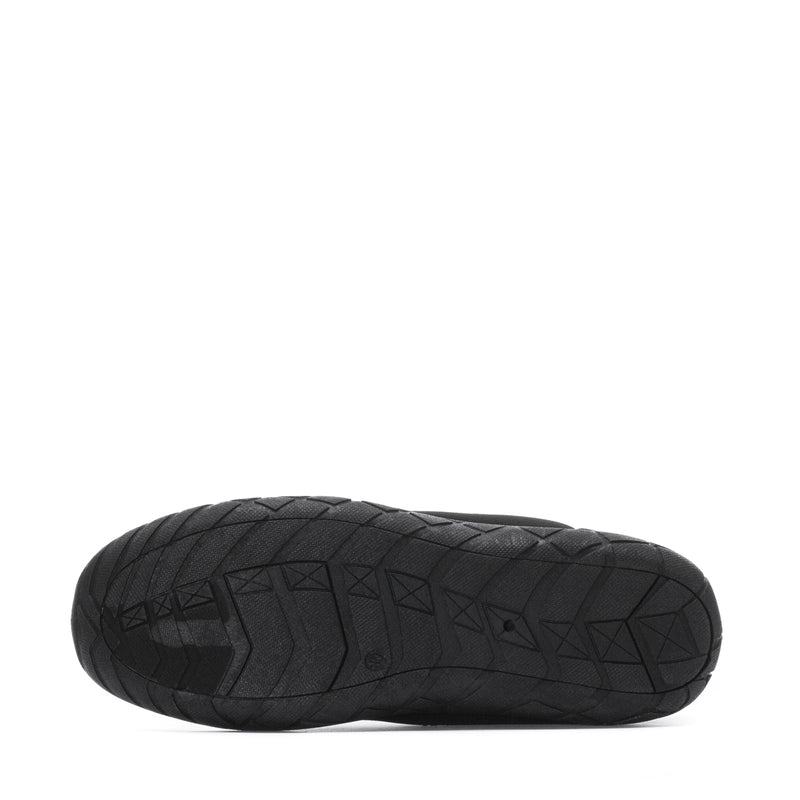 Black outsole of slip-on water shoe with geometric traction tread