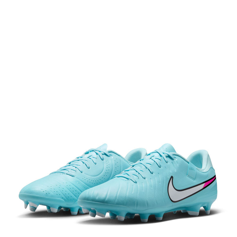 Pair of light blue soccer cleats, two-quarter angle, Nike swoosh and magenta trim