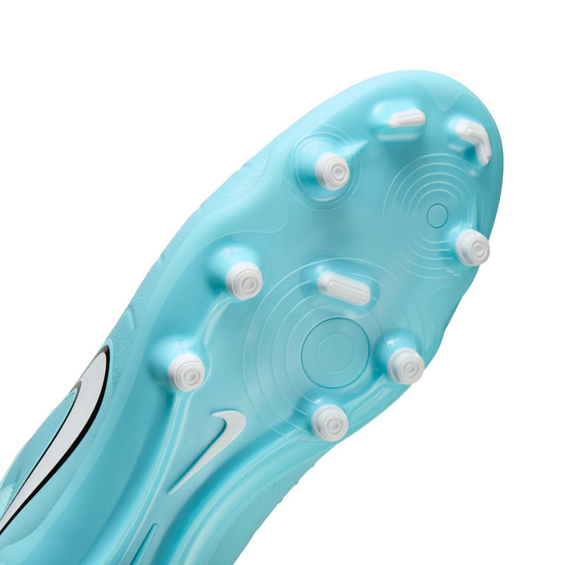 Light blue soccer cleat outsole, MG traction studs and circular tread pattern