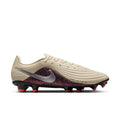 Men's soccer cleat in cream with Nike swoosh, burgundy leopard collar, red FG studs