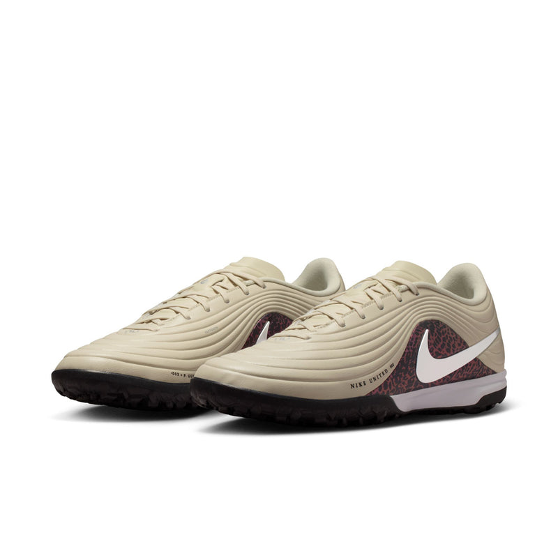 Pair of beige Nike Tiempo Maestro TF turf shoes, side view, silver swoosh, burgundy lining