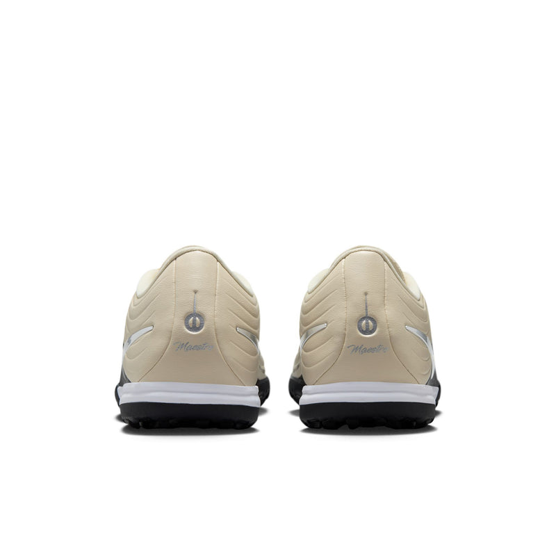Beige Nike Tiempo Maestro TF turf shoes, rear view with heel tabs and black outsole