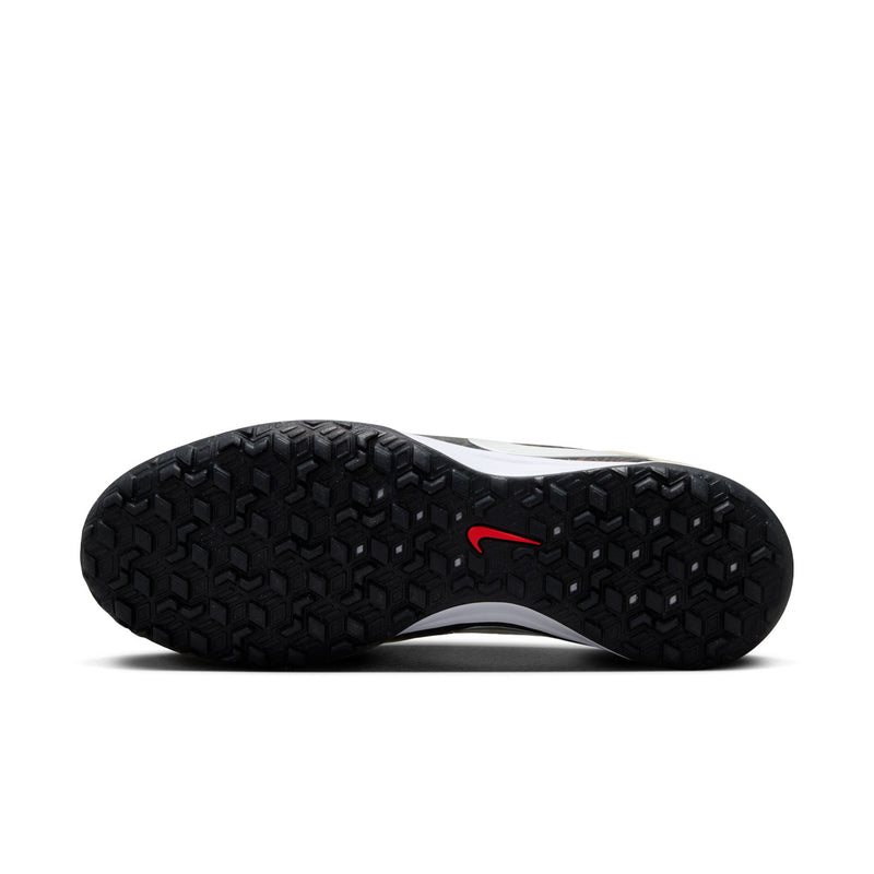 Black outsole with rugged tread on beige Nike Tiempo Maestro TF turf shoes