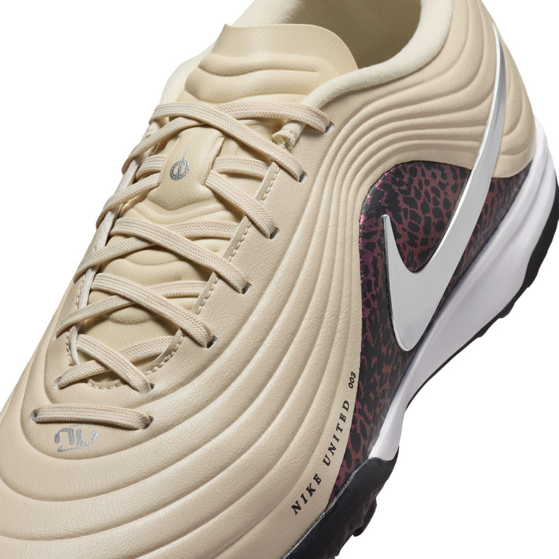 Beige Nike Tiempo Maestro TF shoe upper with laces, silver swoosh, burgundy animal pattern