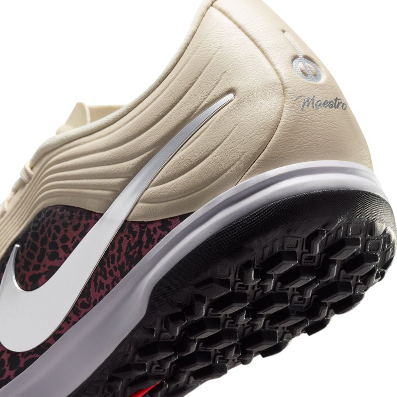 Beige Nike Tiempo Maestro TF shoe side with Maestro logo, silver swoosh, dark tread sole