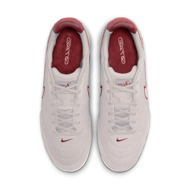 Men's low-top sneakers pair view with gray uppers, red-lined tongue, and lace-up