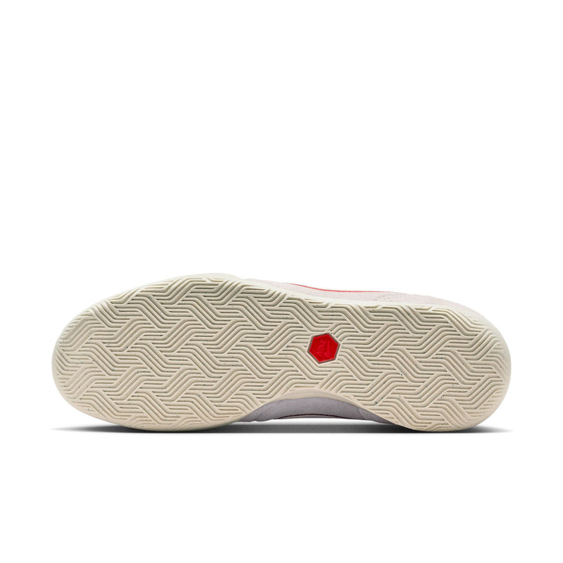Men's sneaker outsole with textured zigzag tread on off-white rubber and red logo