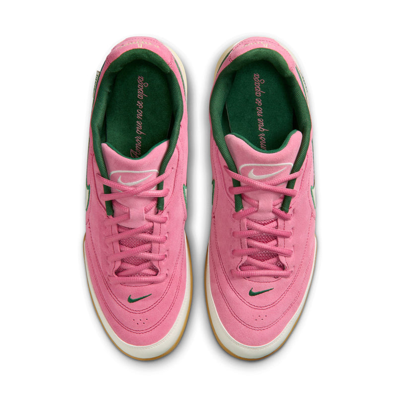Men's pink sneakers with green lining, pink laces, and white outsole edges