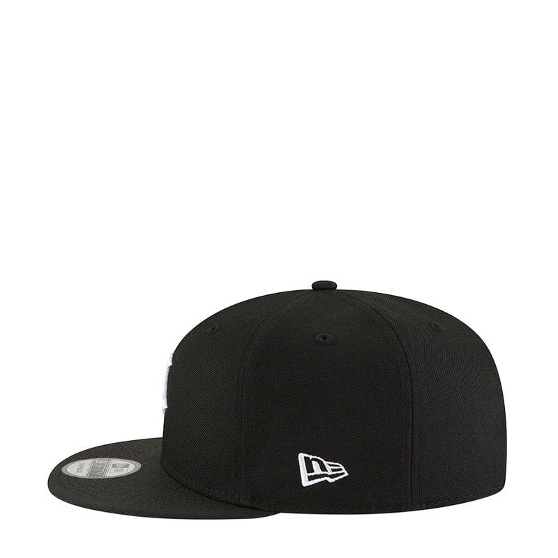 Black baseball cap with white New Era logo on front