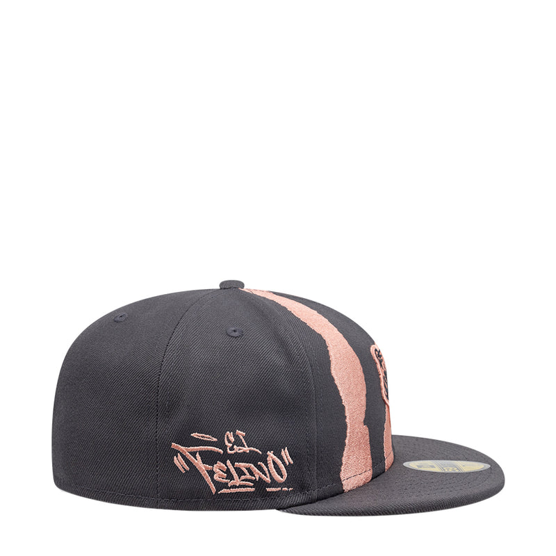Dark grey snapback cap with coral-pink zebra stripe panel and small logo