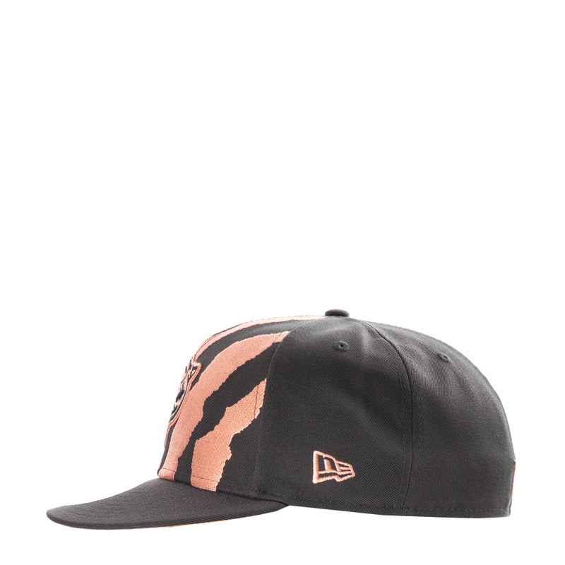 Dark grey snapback cap with coral zebra stripe graphic and New Era flag logo