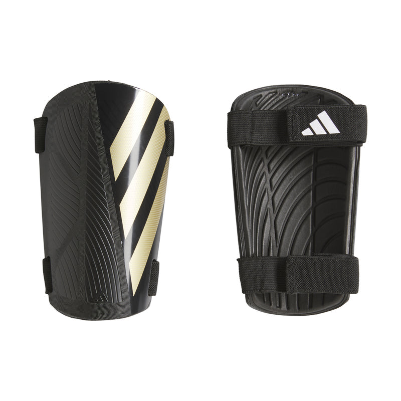 Black shin guard pair with adjustable straps and metallic gold-and-white diagonal stripes