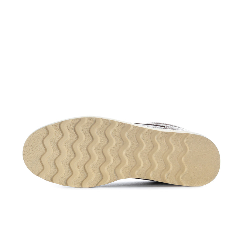 Men's tan rubber outsole with textured tread for traction