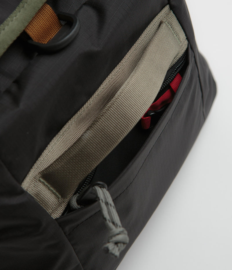 Topo Designs Mountain 40L Duffel Bag in Black and Neutral