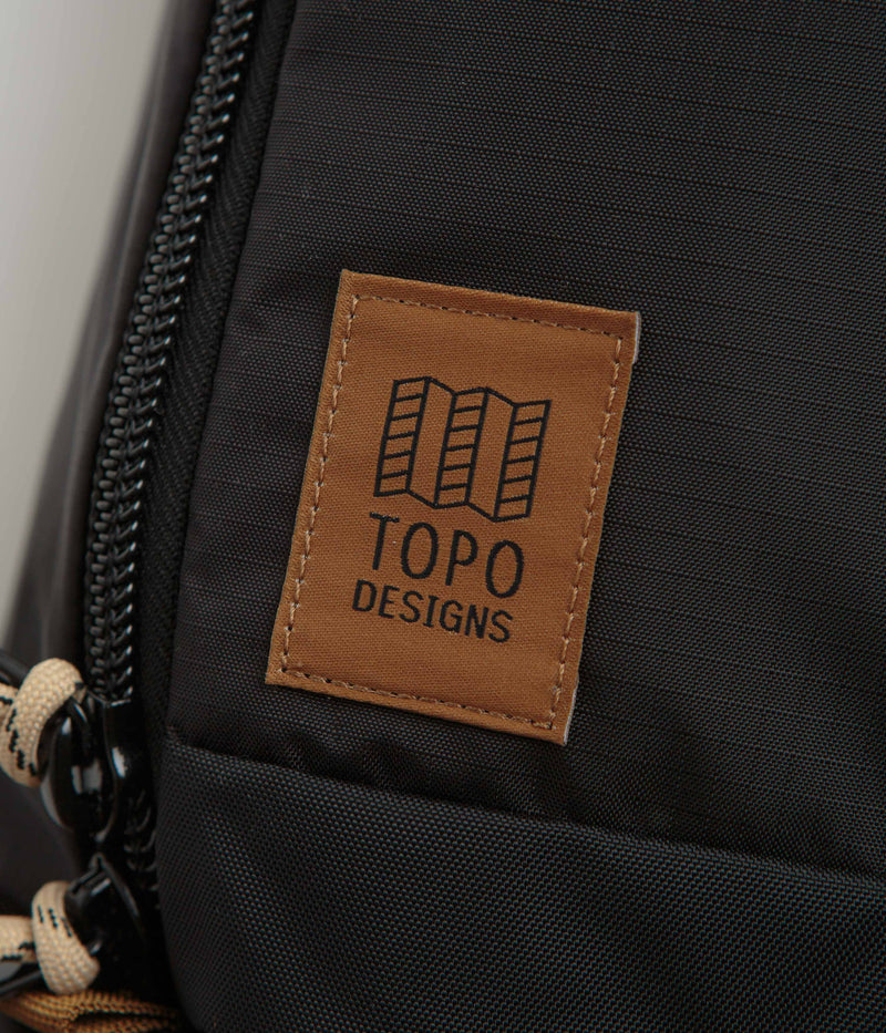 Topo Designs Mountain Sling Bag in Black and Neutral