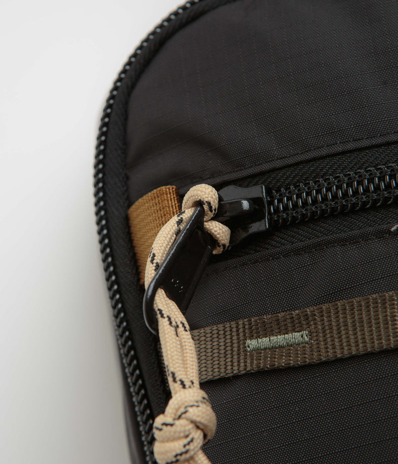 Topo Designs Mountain Sling Bag in Black and Neutral