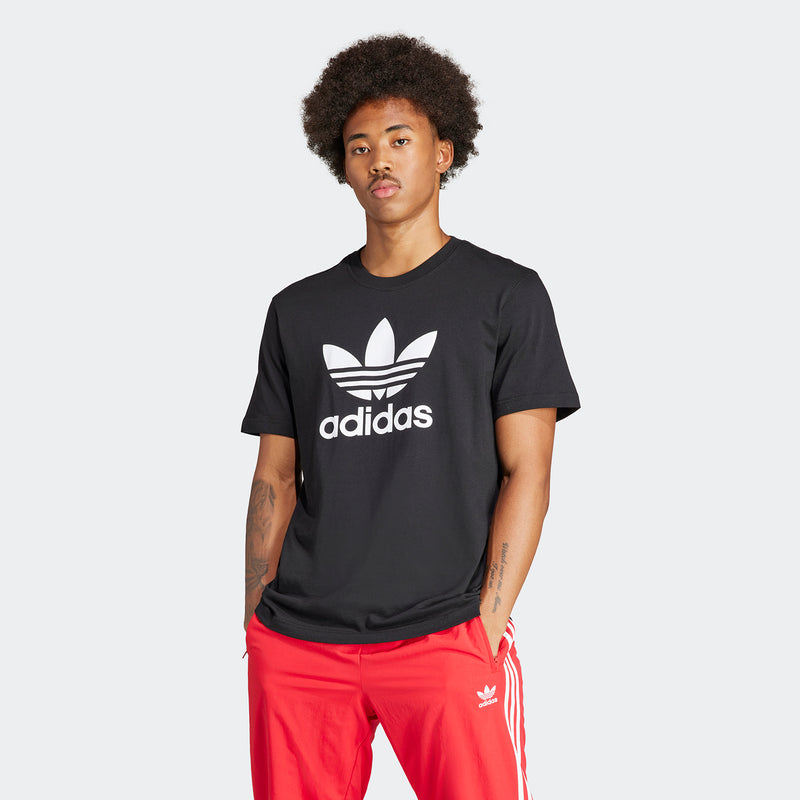 Men's black T-shirt with large white adidas trefoil and wordmark on front