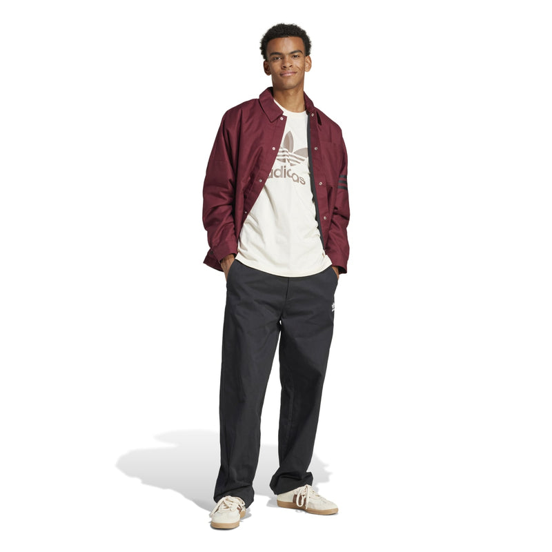 White crew-neck T-shirt with adidas Trefoil logo, worn under maroon overshirt