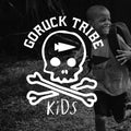 Smiling child in GORUCK Tribe Kids t-shirt running outdoors with backpack, GORUCK logo overlay