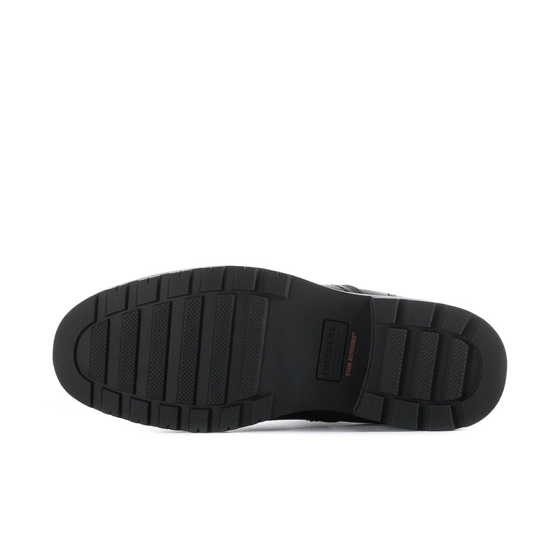 Bottom view of men's black Chelsea boots showing tread pattern