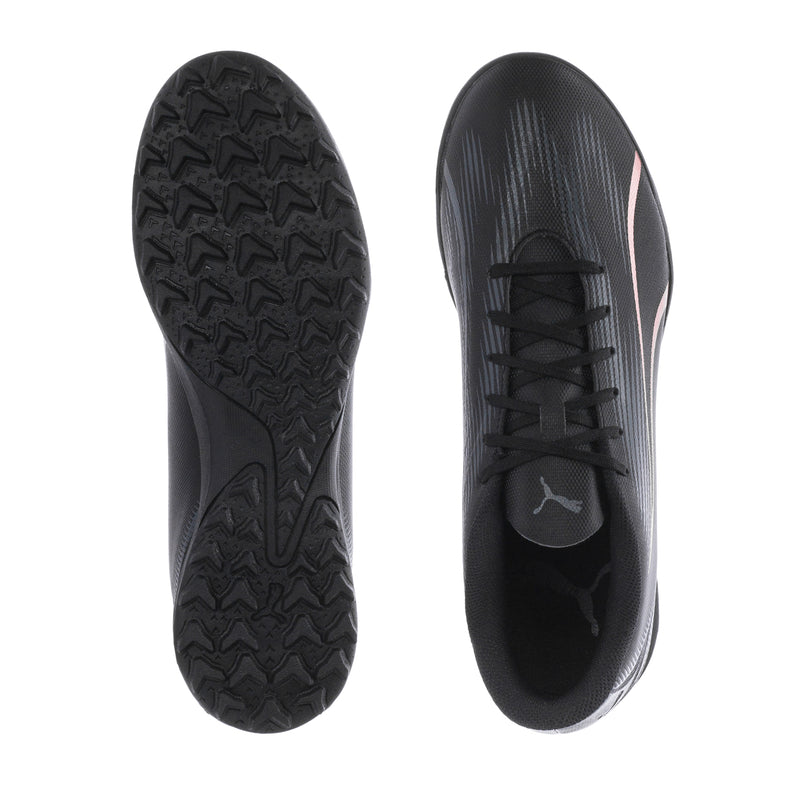 Puma turf soccer shoes: treaded outsole and inside view, black lace-up upper.