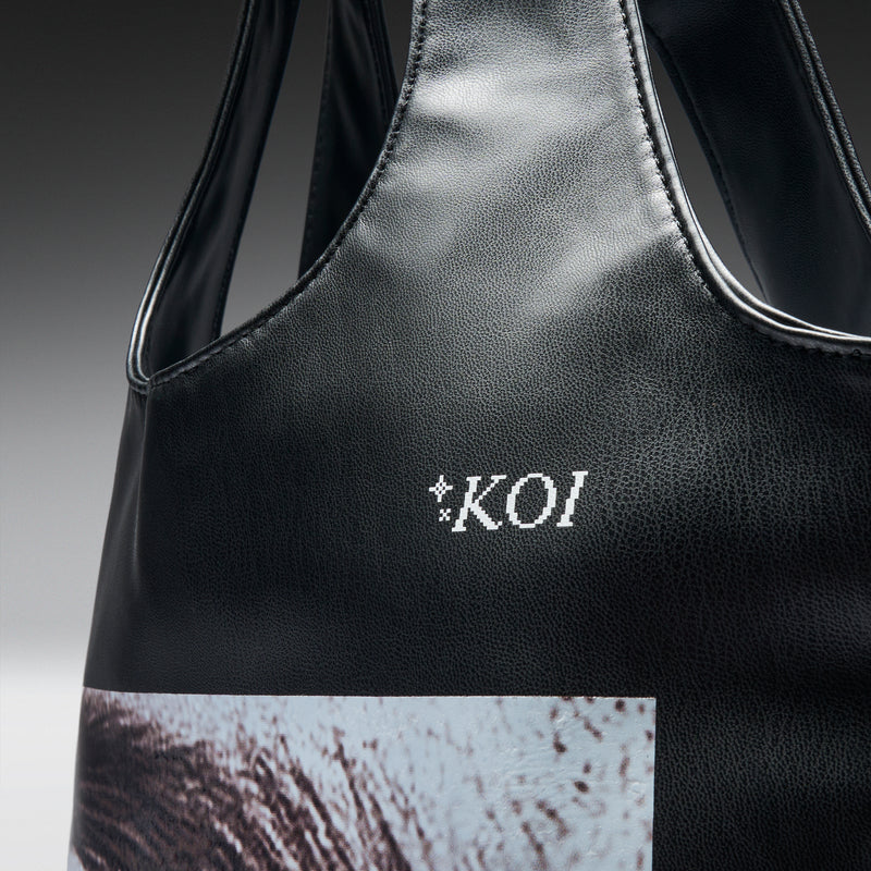 Black bag with 'KOI' logo on a gradient background