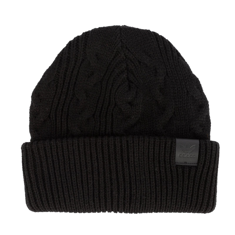 Black cable-knit beanie with folded rib cuff and cable stitch pattern.