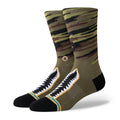 Olive camo crew socks with black toe, heel, and white zigzag front design